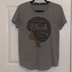 Grey t-shirt. Black woman.